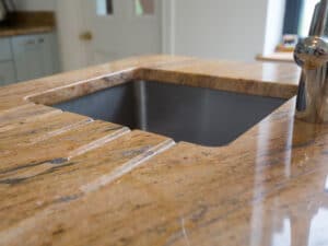 Granite worktops with granite sink surrounds and kitchen tap in bristol